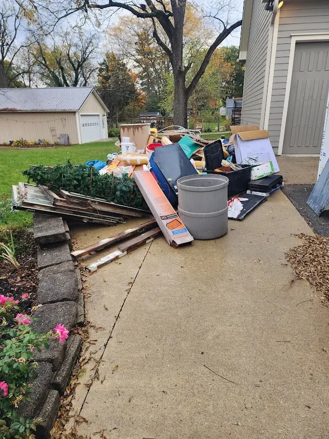 Dumpster being loaded with debris for 30 Yard Dumpster Rental in Smithville